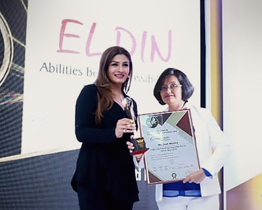 Srutie P Mashru receiving a national trainer award on stage